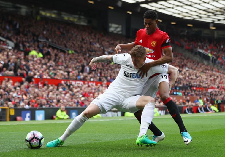 מרכוס ראשפורד מול אלפי מוסון. צילום: gettyimages
