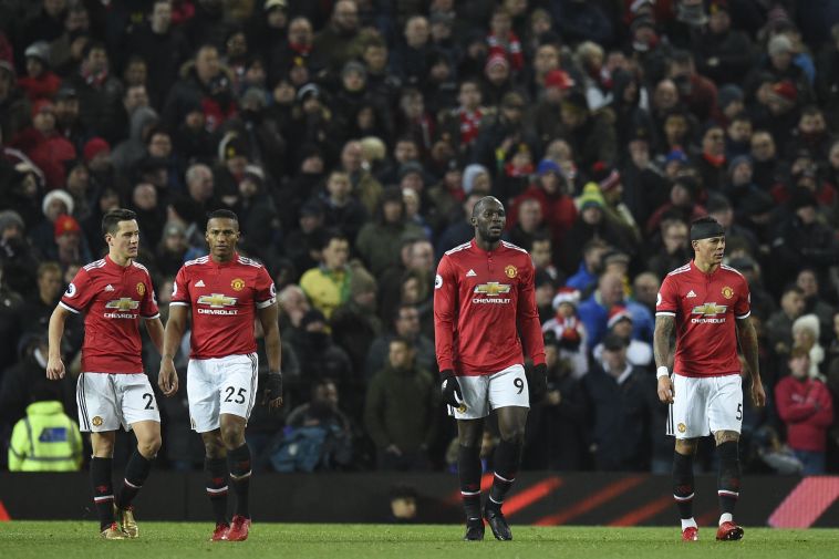 אי אפשר להסתיר את האכזבה על פניהם של שחקני יונייטד (AFP)