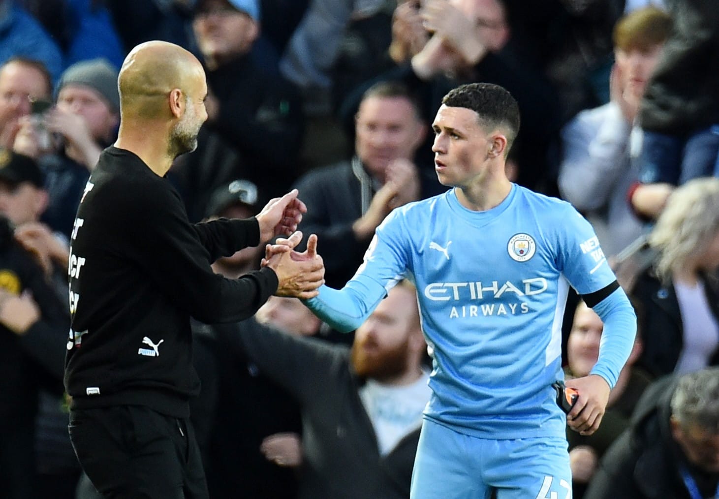 פיל פודן שחקן מנצ'סטר סיטי עם פפ גווארדיולה