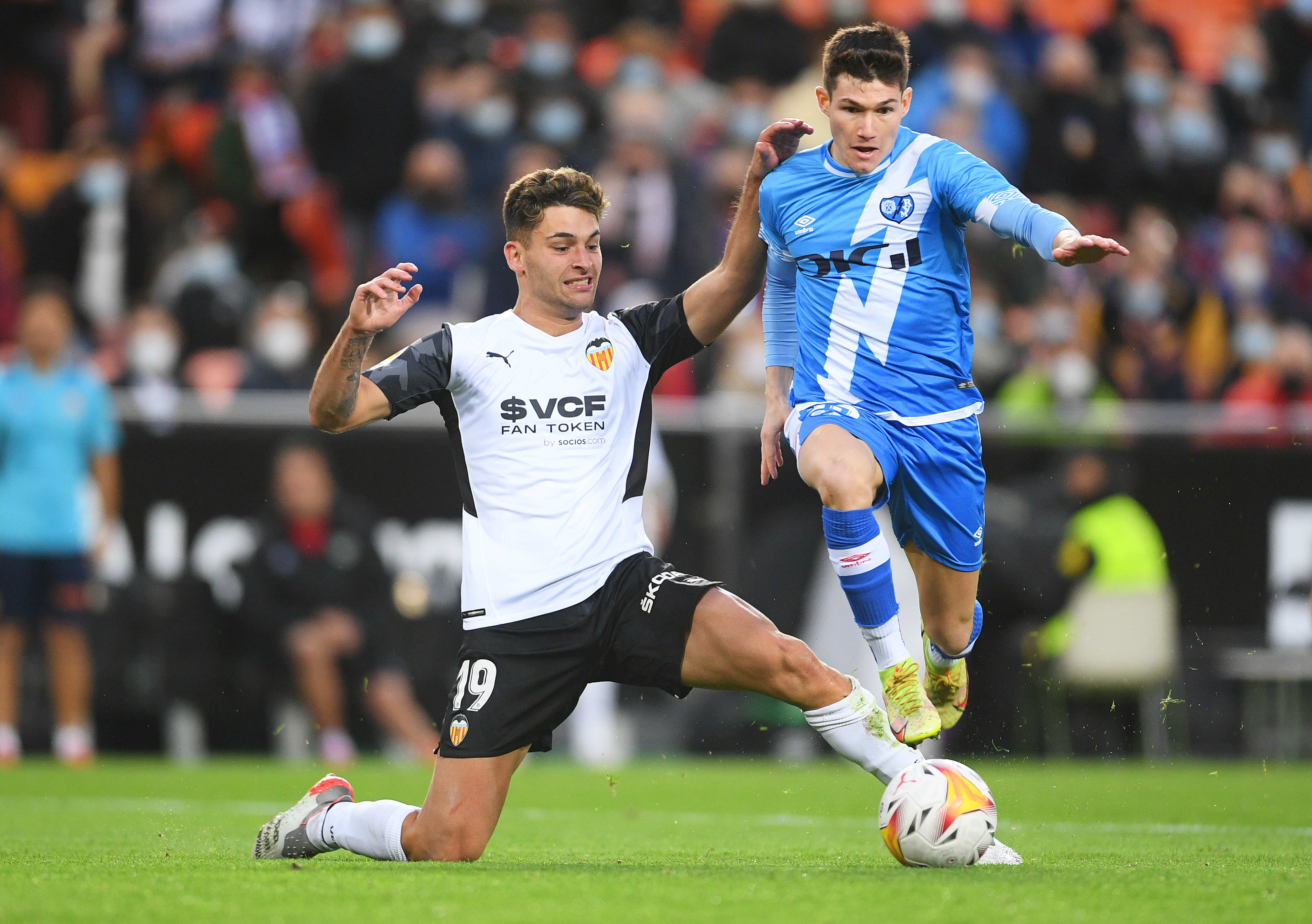 Valencia player Helder Costa, opposite Rayo Vallecano player Fran Garcia