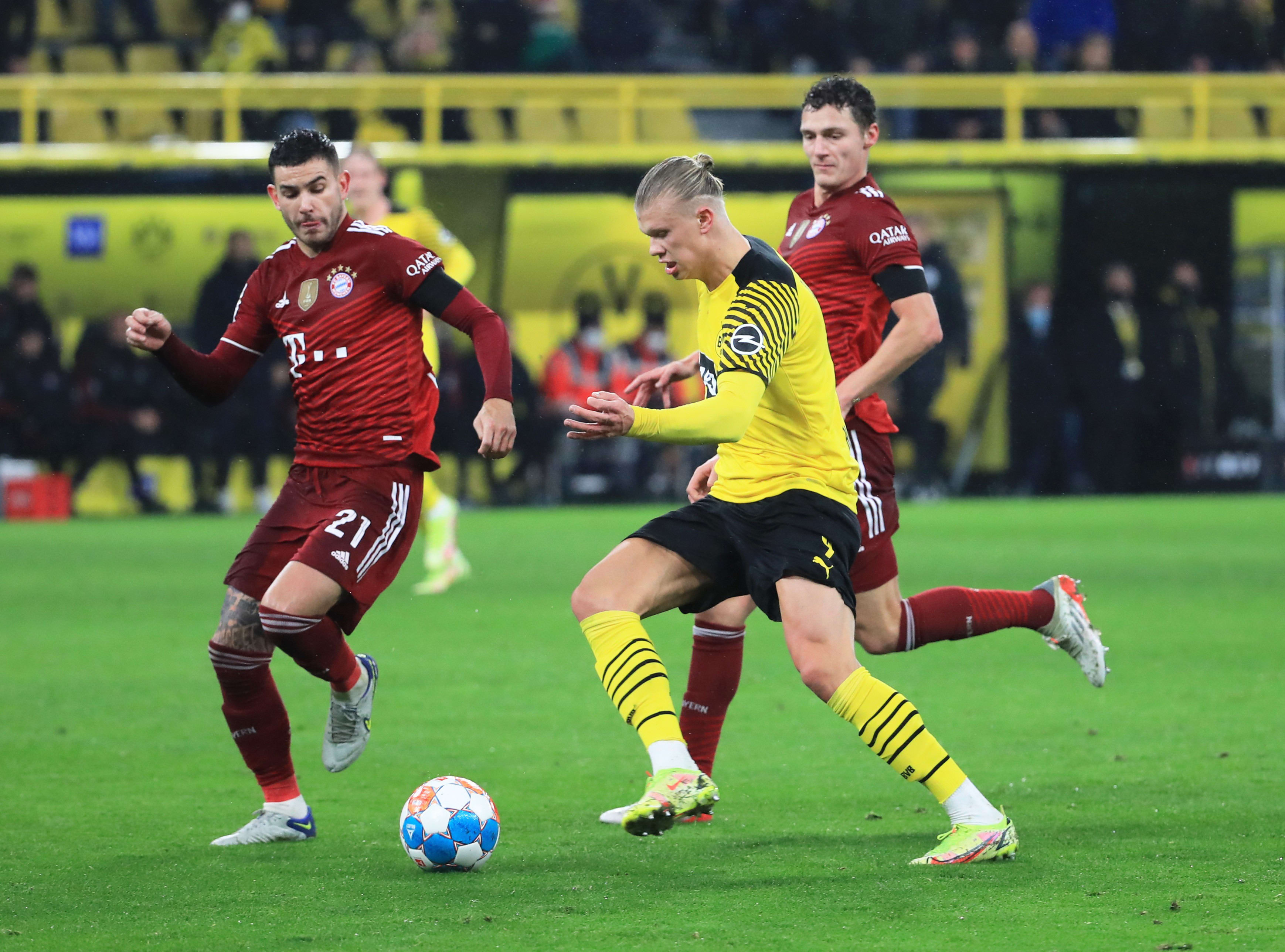 לוקאס הרננדז שחקן באיירן מינכן מול ארלינג הולאנד שחקן בורוסיה דורטמונד