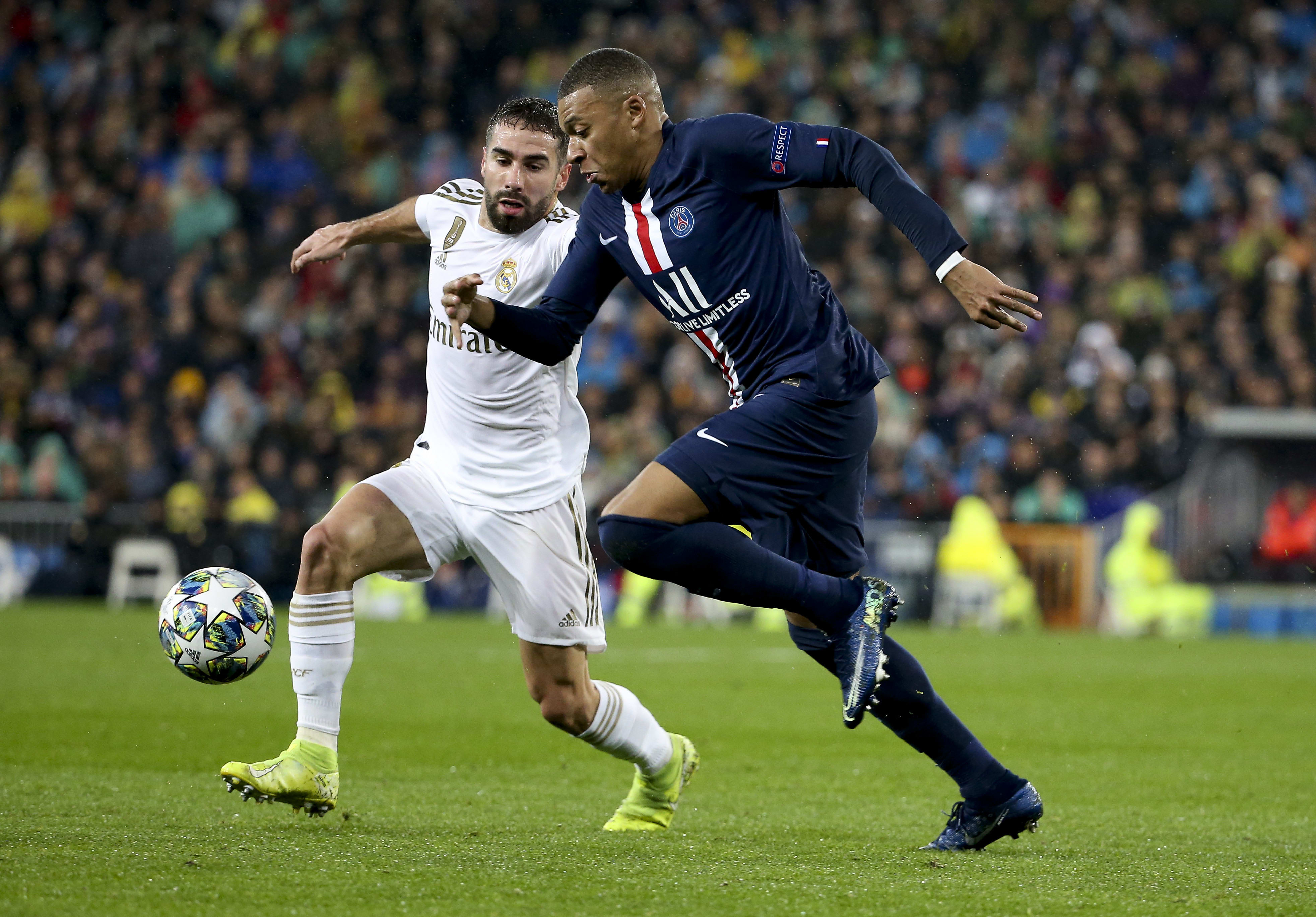 שחקן ריאל מדריד דני קרבחאל, מול שחקן פריז סן ז'רמן, קיליאן אמבפה ב-2019