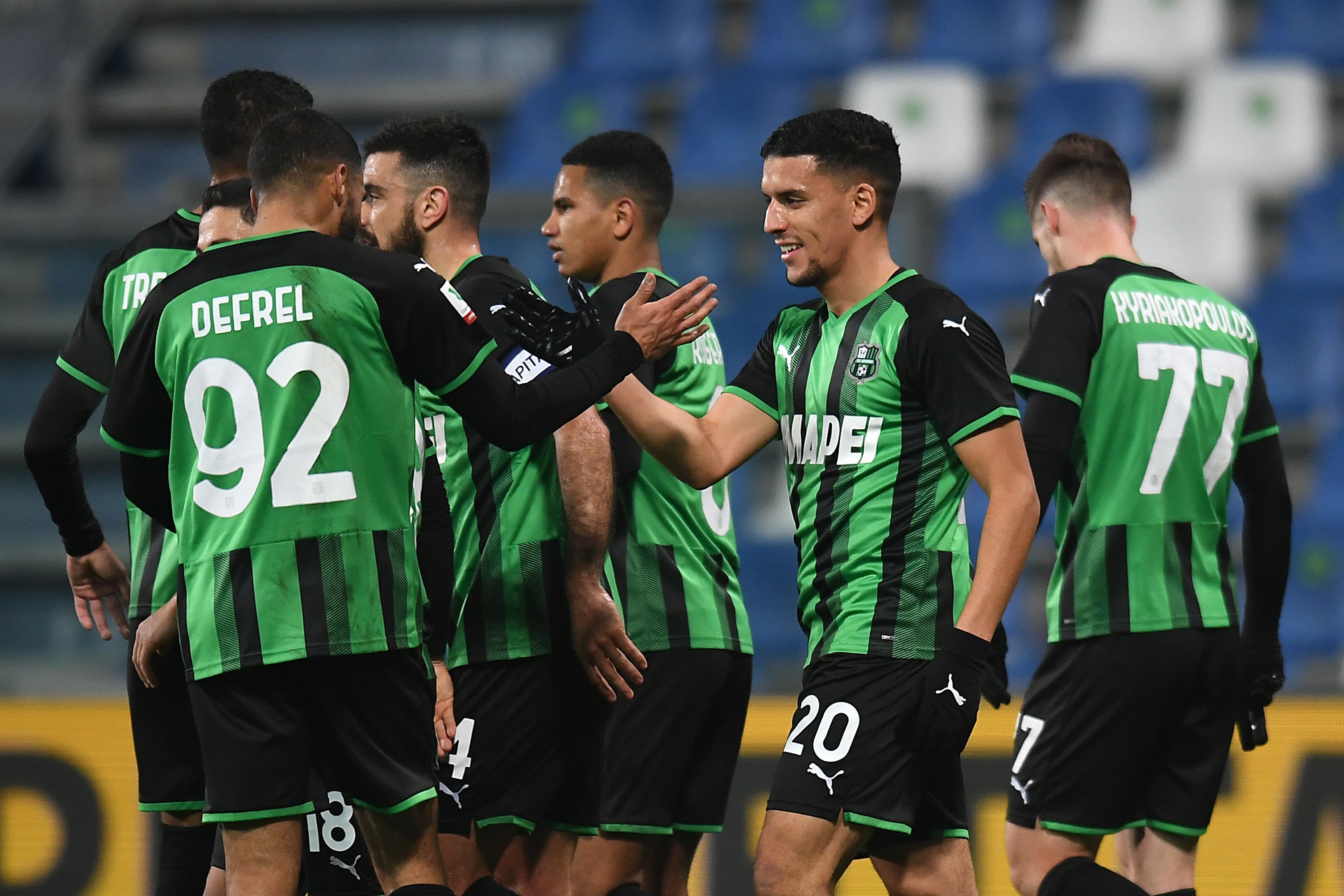 Sassuolo players celebrate with Abdu Harvey