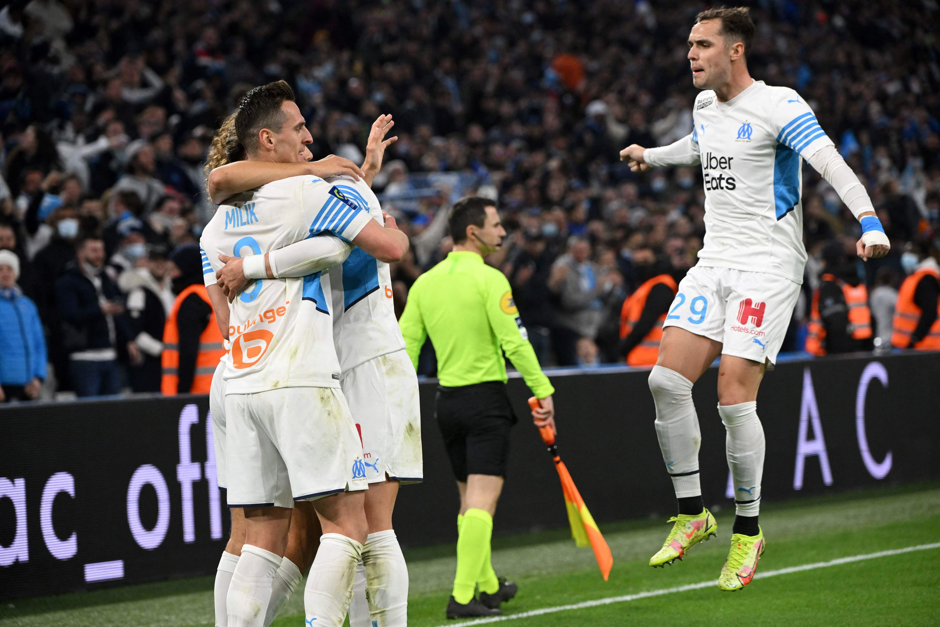 Marseille players celebrate with Arkadyush Milik