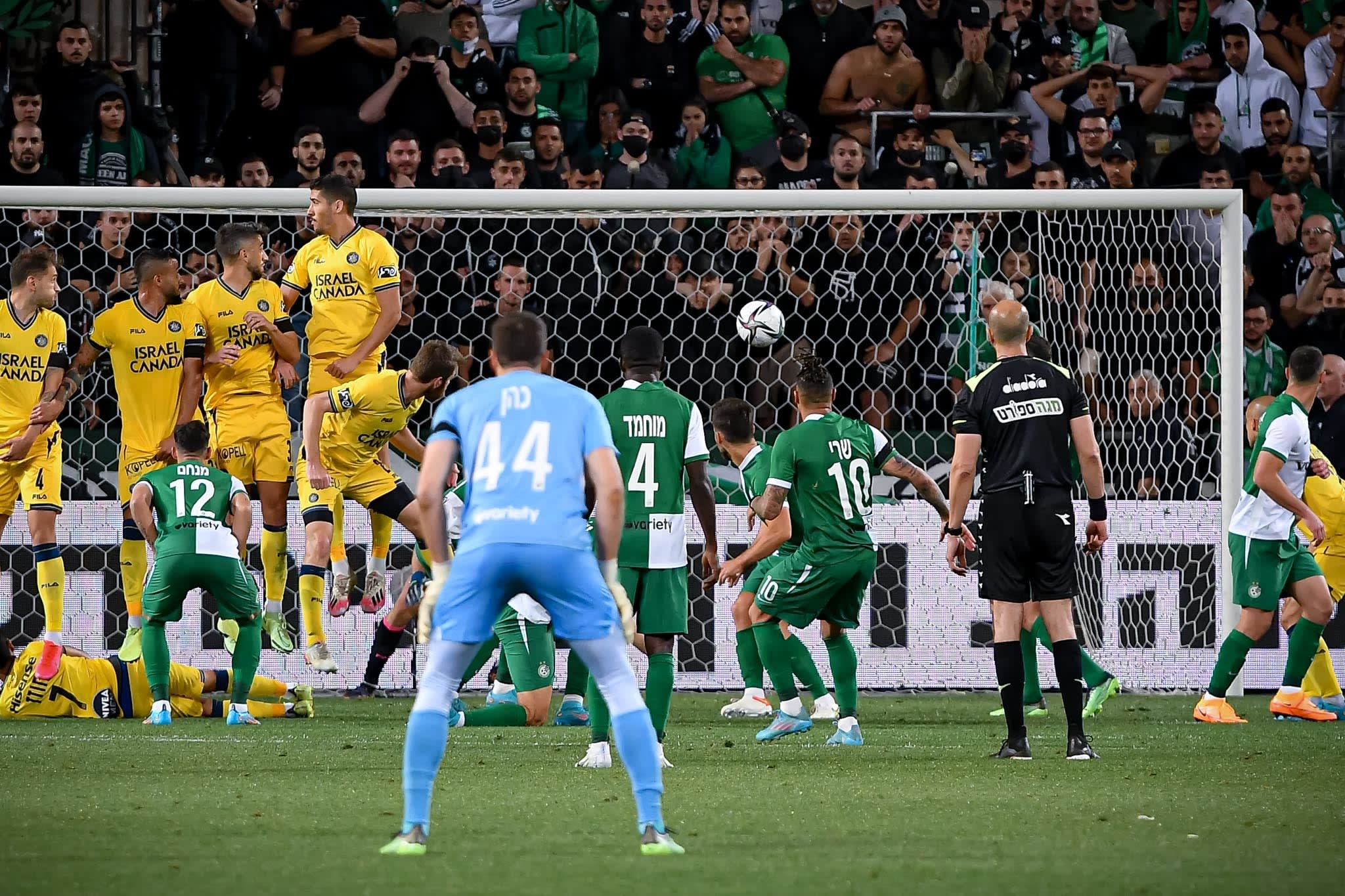 Charon Sheri, a Maccabi Haifa player, kicks a free kick