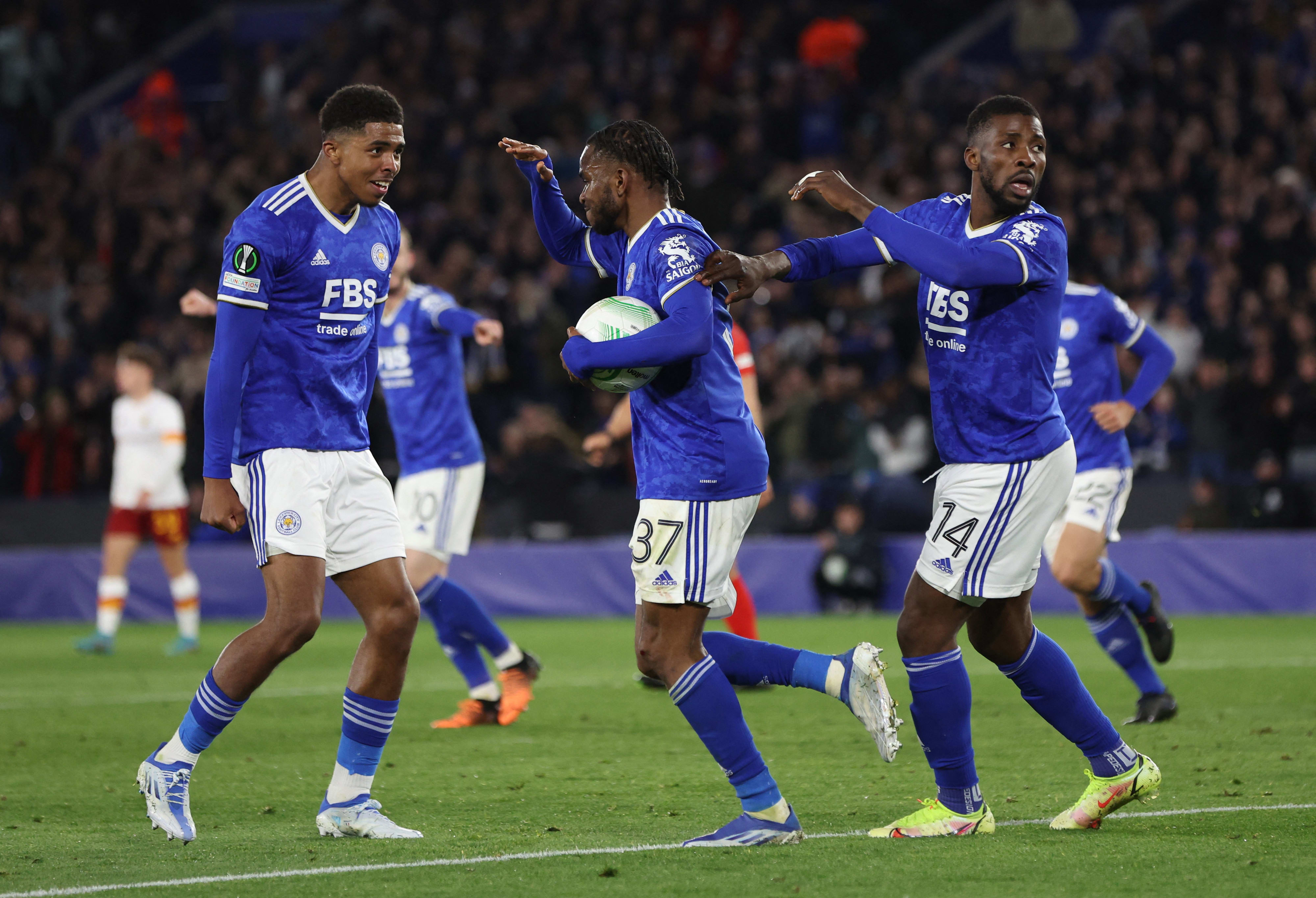 Leicester City players celebrate with Admola Lockman (center)