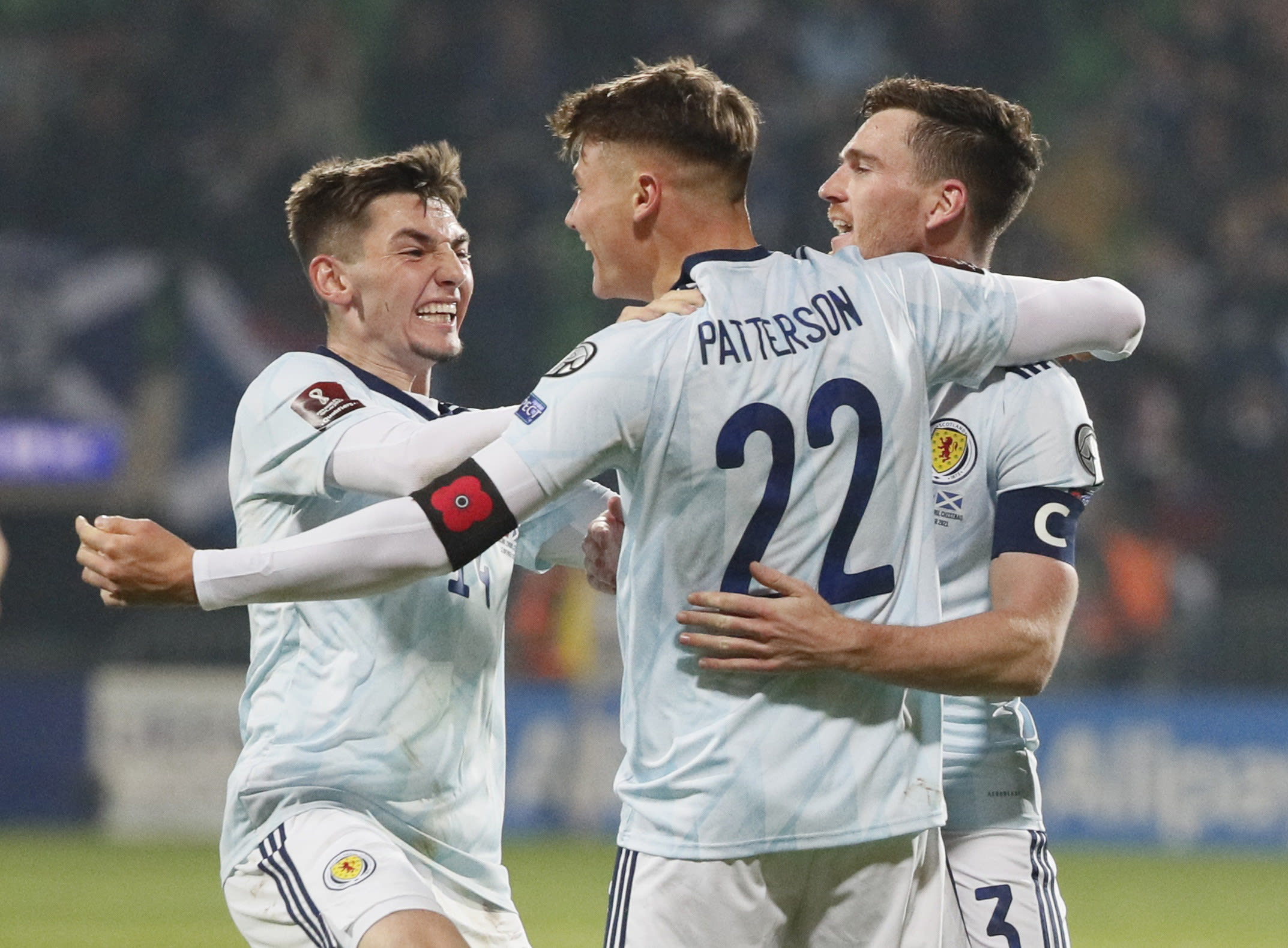 Scotland's players celebrate with Nathan Patterson after scoring against Moldova