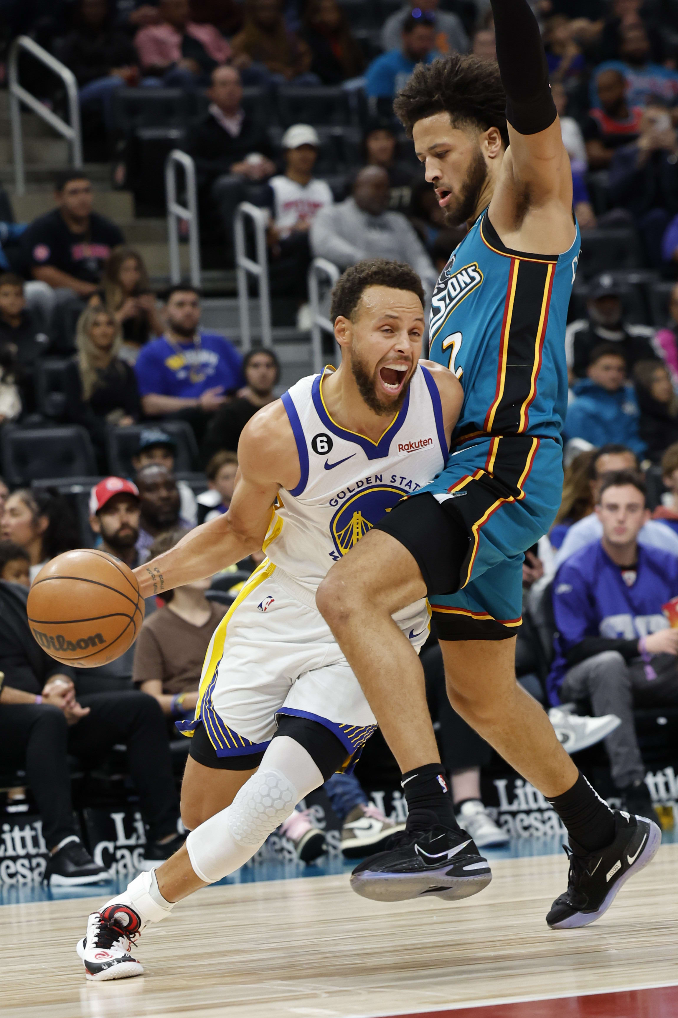 סטפן קרי שחקן גולדן סטייט ווריירס מול קייד קאניניגהאם שחקן דטרויט פיסטונס