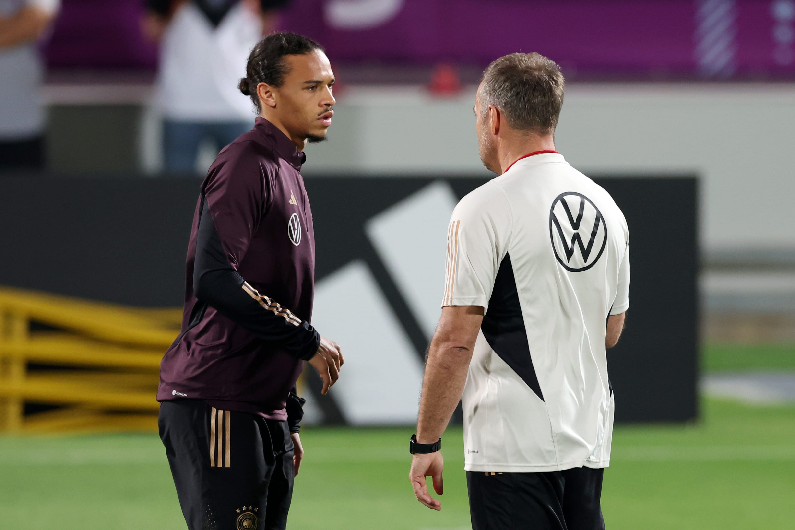 German national team player Leroy Sane with coach Hansi Flick