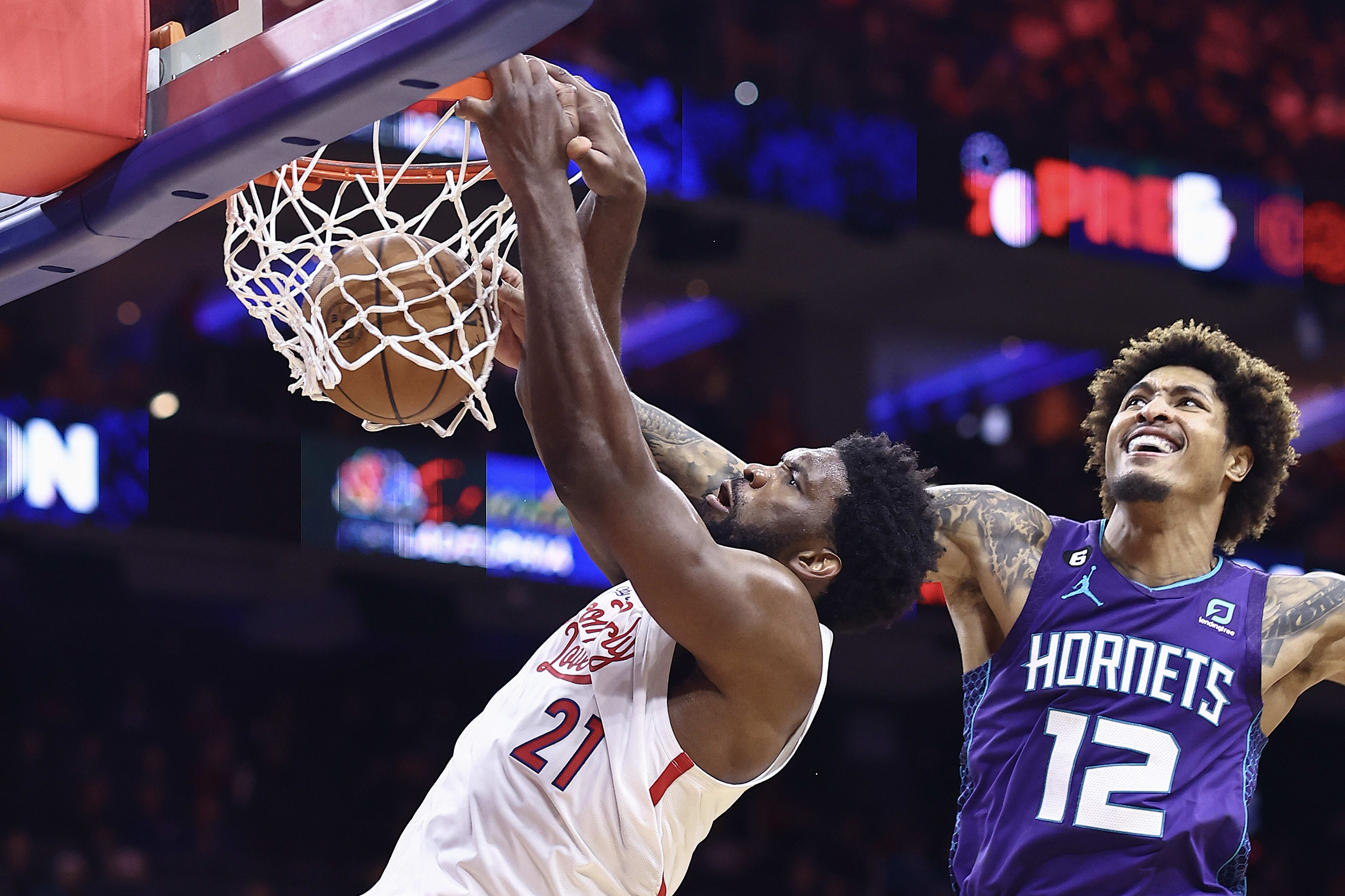 Philadelphia center Joel Embiid dunks against Charlotte