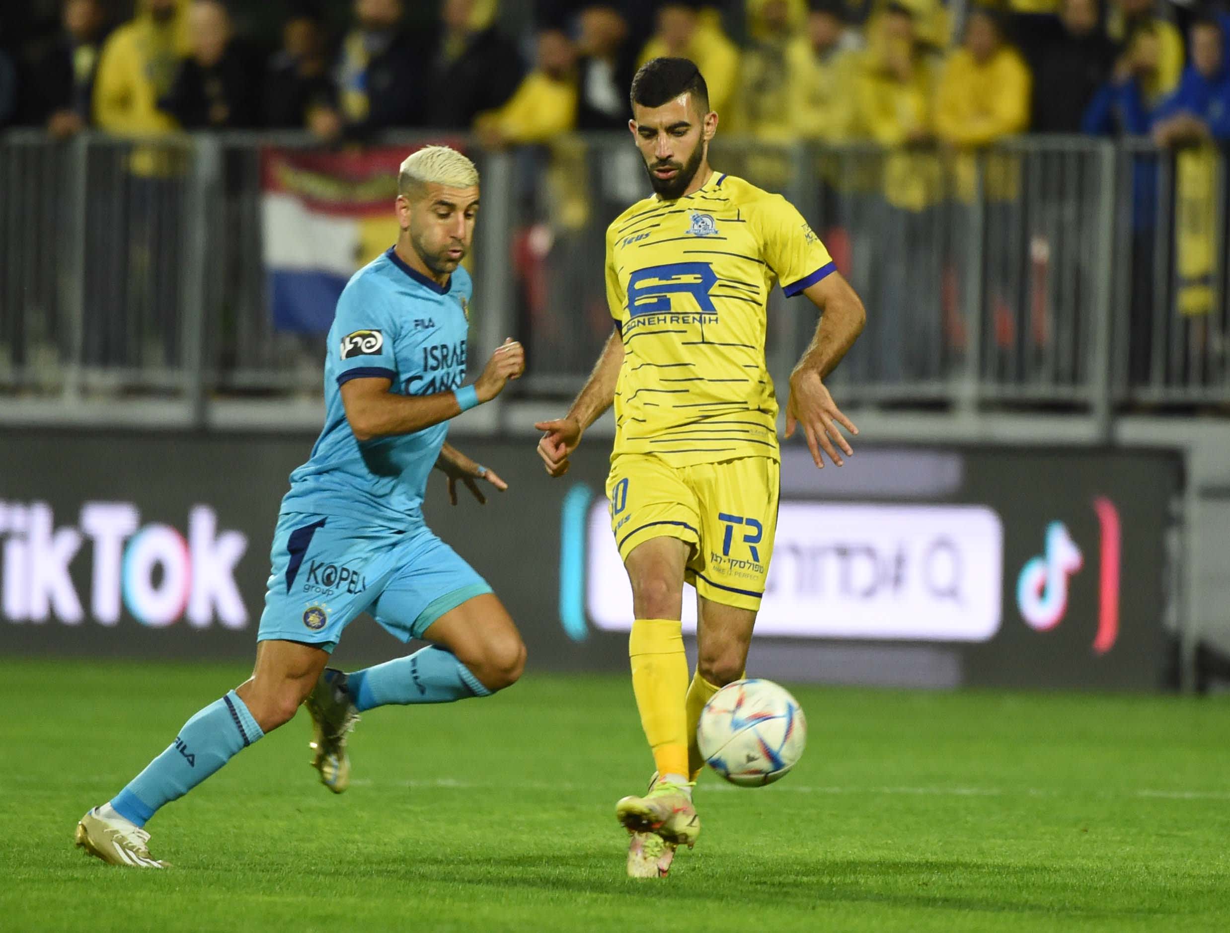 אבי ריקן, שחקן מכבי תל אביב לצד מופלח שלאעטה, שחקן מכבי בני ריינה