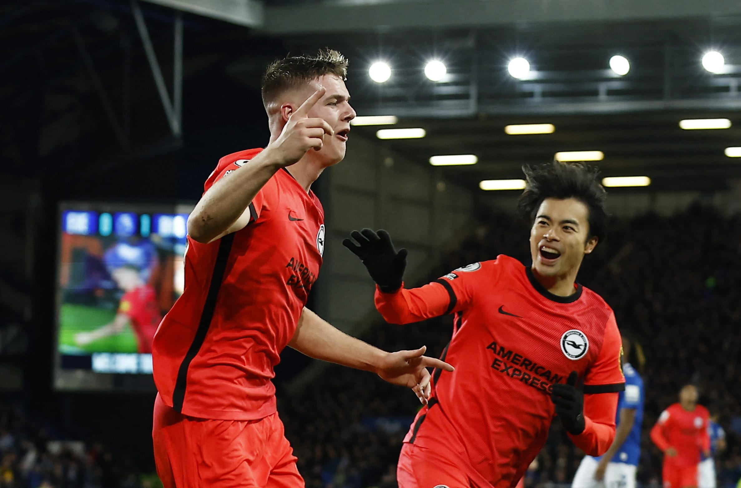 Brighton player Owen Ferguson celebrates with Kaoru Mitoma