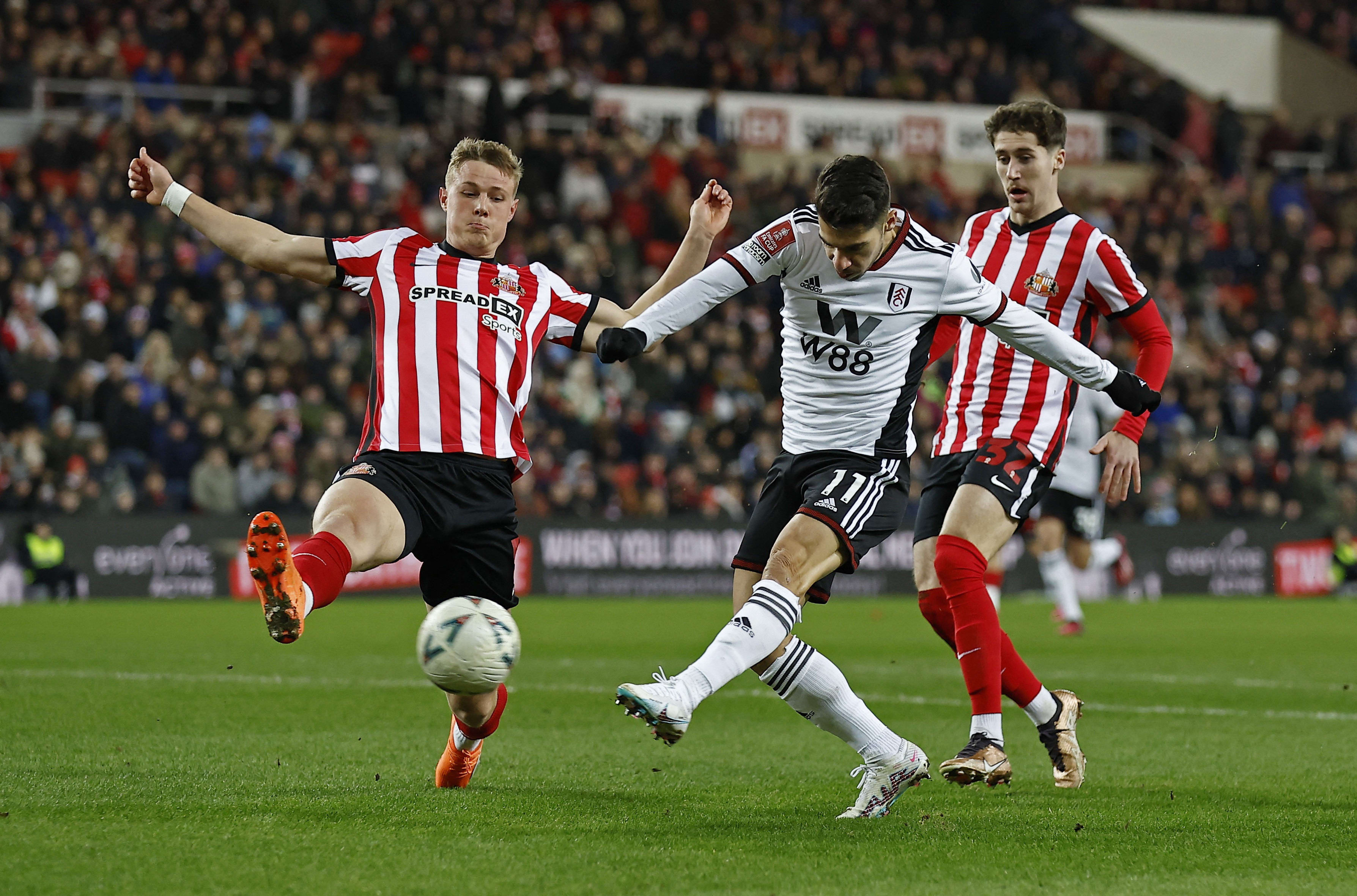 Fulham's Manor Solomon kicks a goal against Sunderland