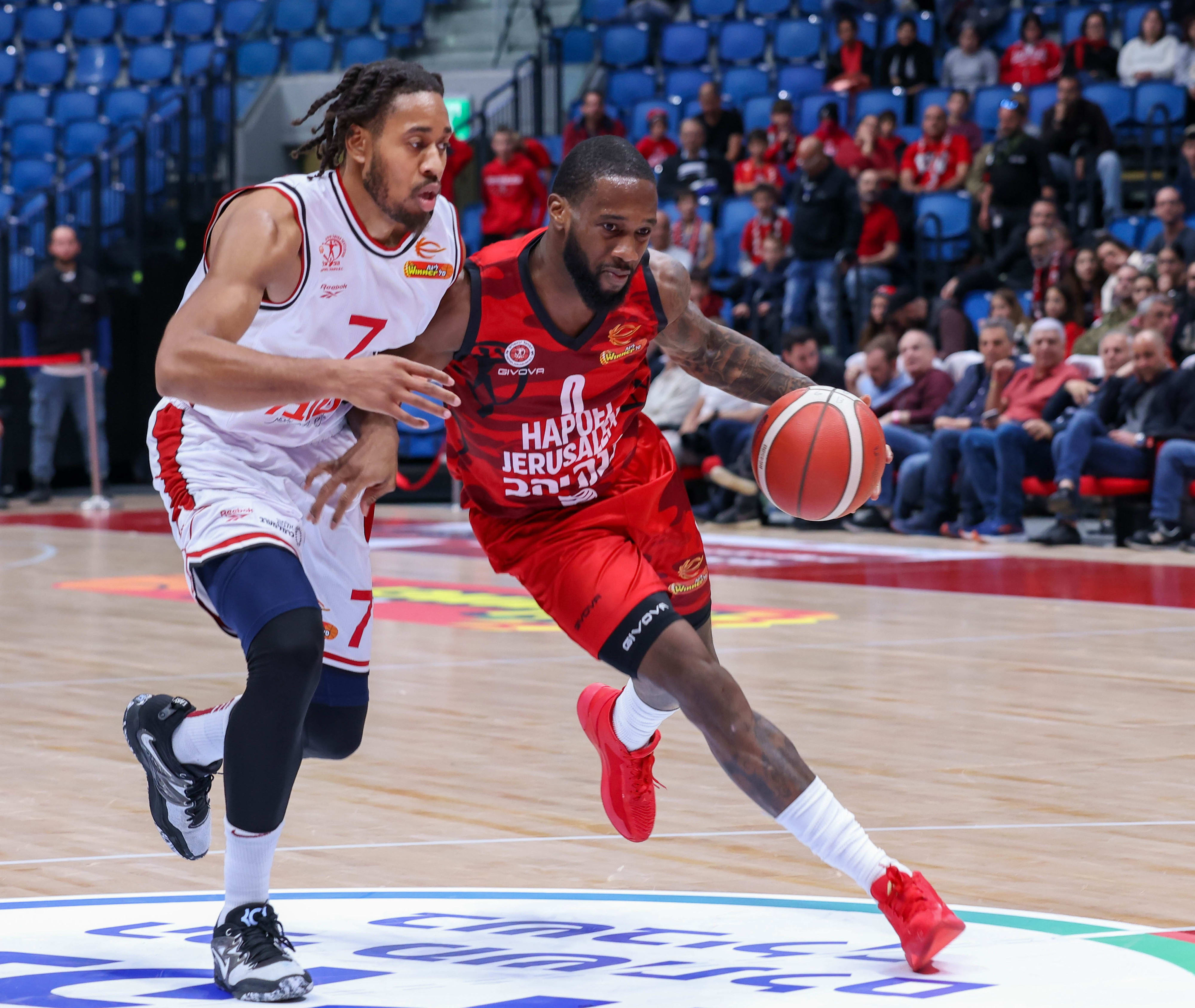 Hapoel Jerusalem player Kadin Carrington against Hapoel Haifa player Isaiah Cousins