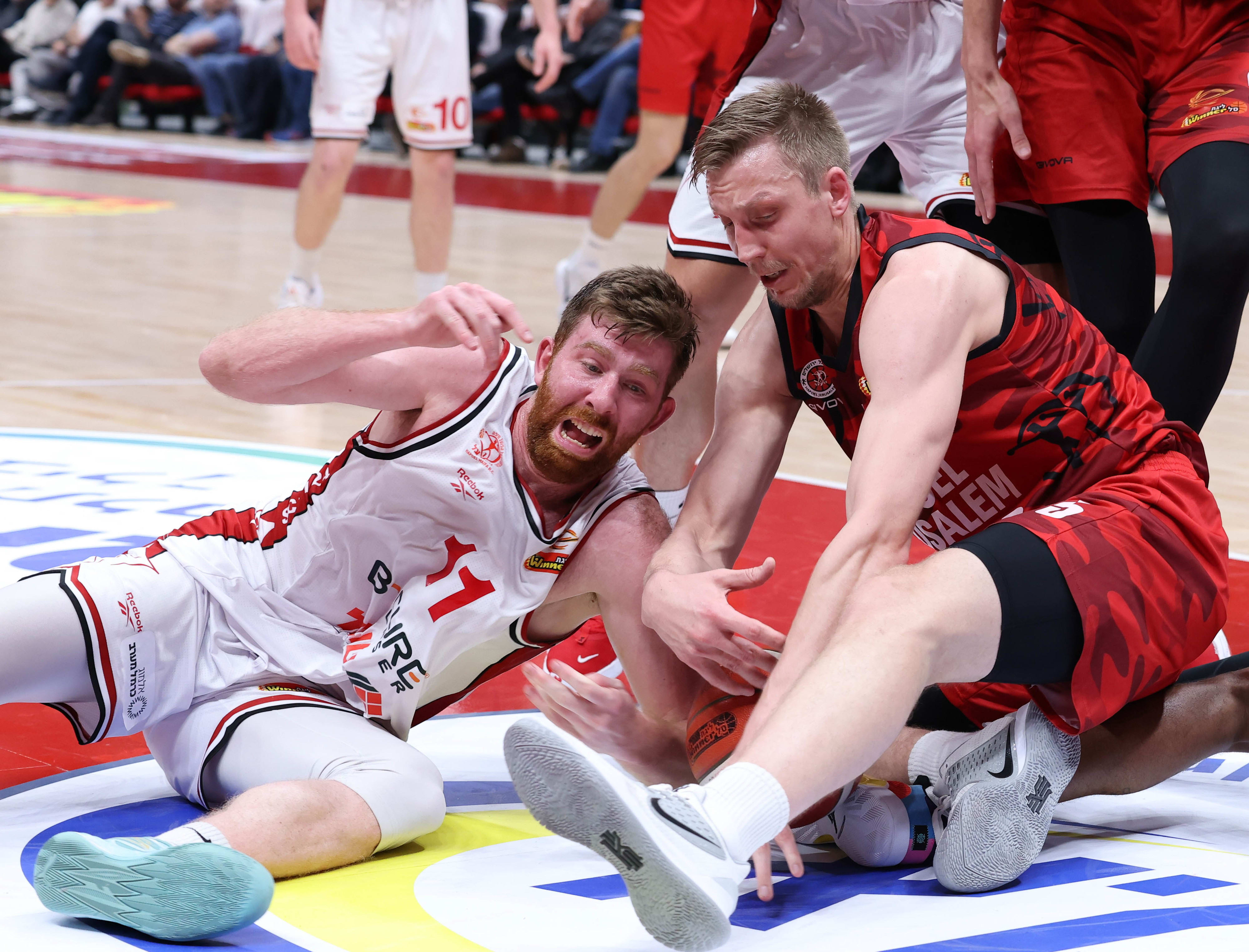 Hapoel Jerusalem player Marks Meiris against Hapoel Haifa player Will Reiman