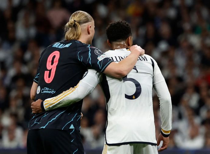 ארלינג הולאנד מנצ'סטר סיטי לצד ג'וד בלינגהאם ריאל מדריד