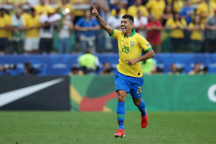 פירמינו חוגג את השער השני של ברזיל (Alexandre Schneider/Getty Images)